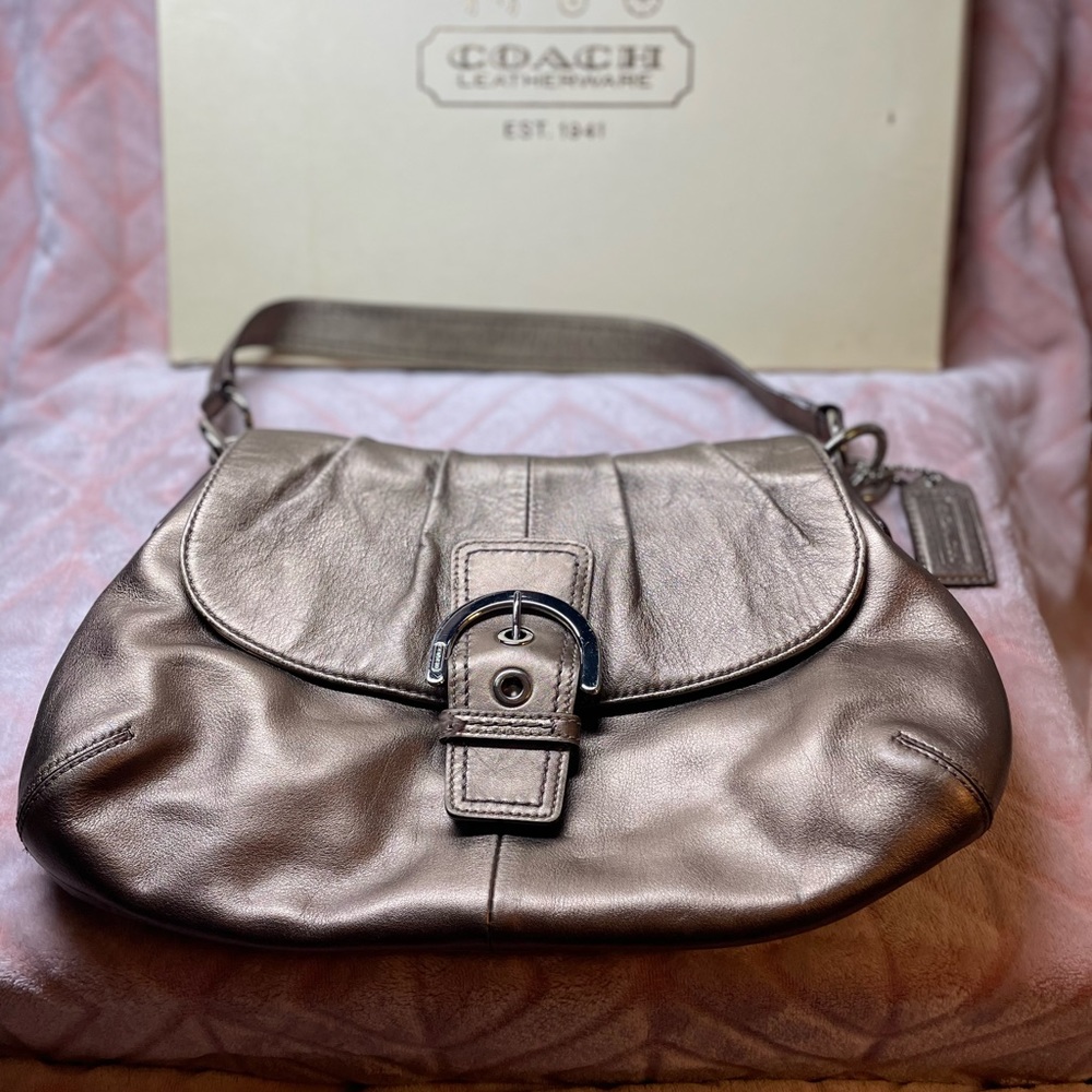 This is a unique Metallic gold Coach shoulder purse